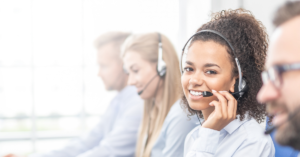 Contact Center employee smiling while wearing a headset