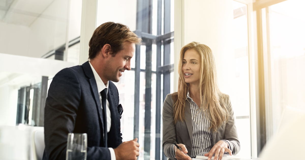Business Insight Businessman talking to businesswoman