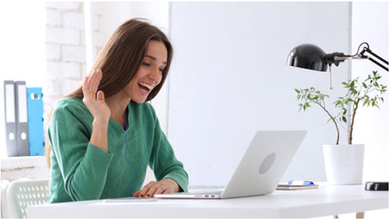 Girl waving at monitor Girl waving at monitor